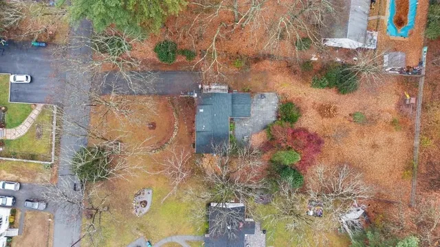aerial view of a house with a yard