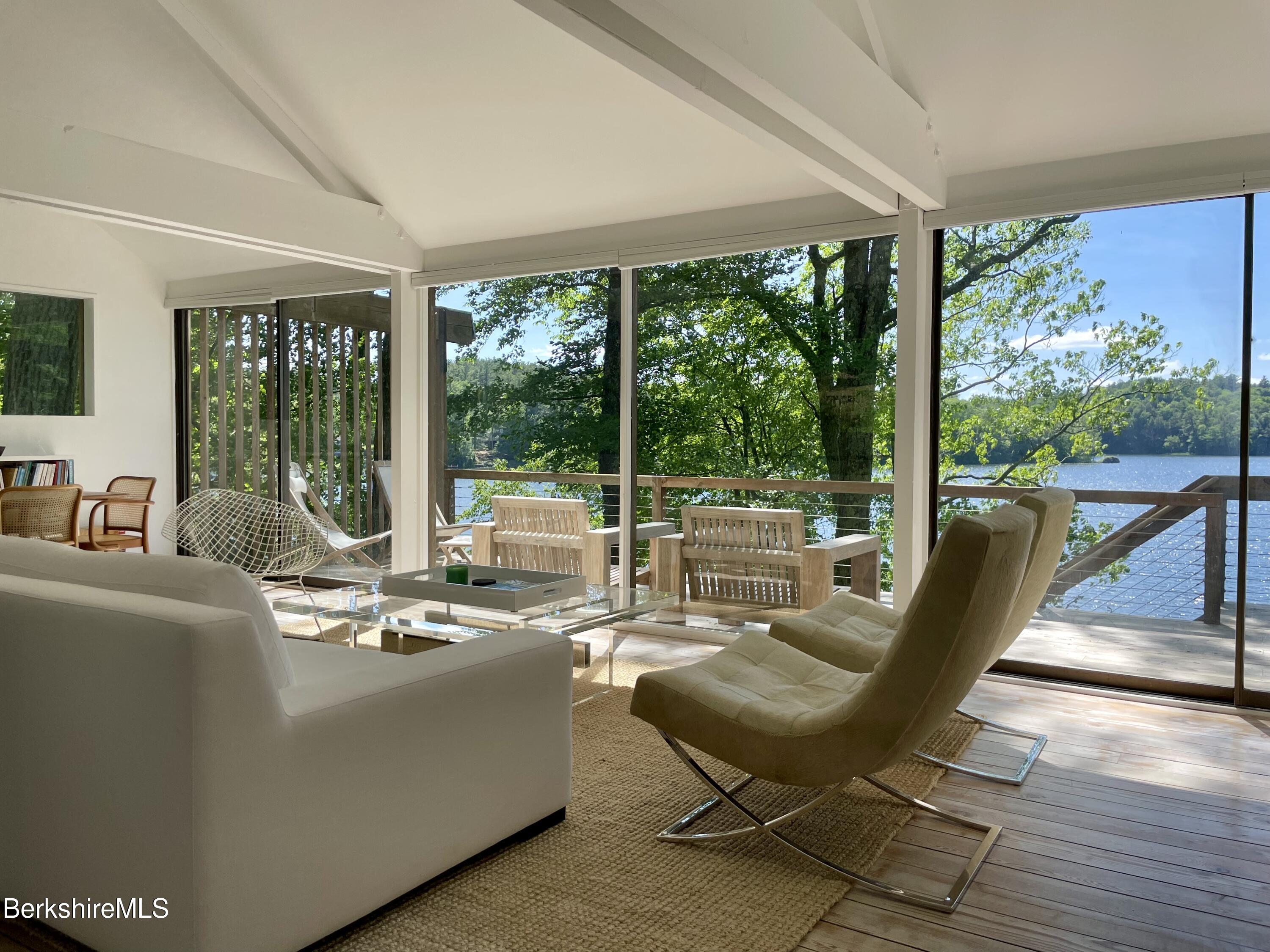 36 Elephant Rock Road Monterey, MA 01245 - Photo 13 of 30 a living room with furniture and floor to ceiling windows