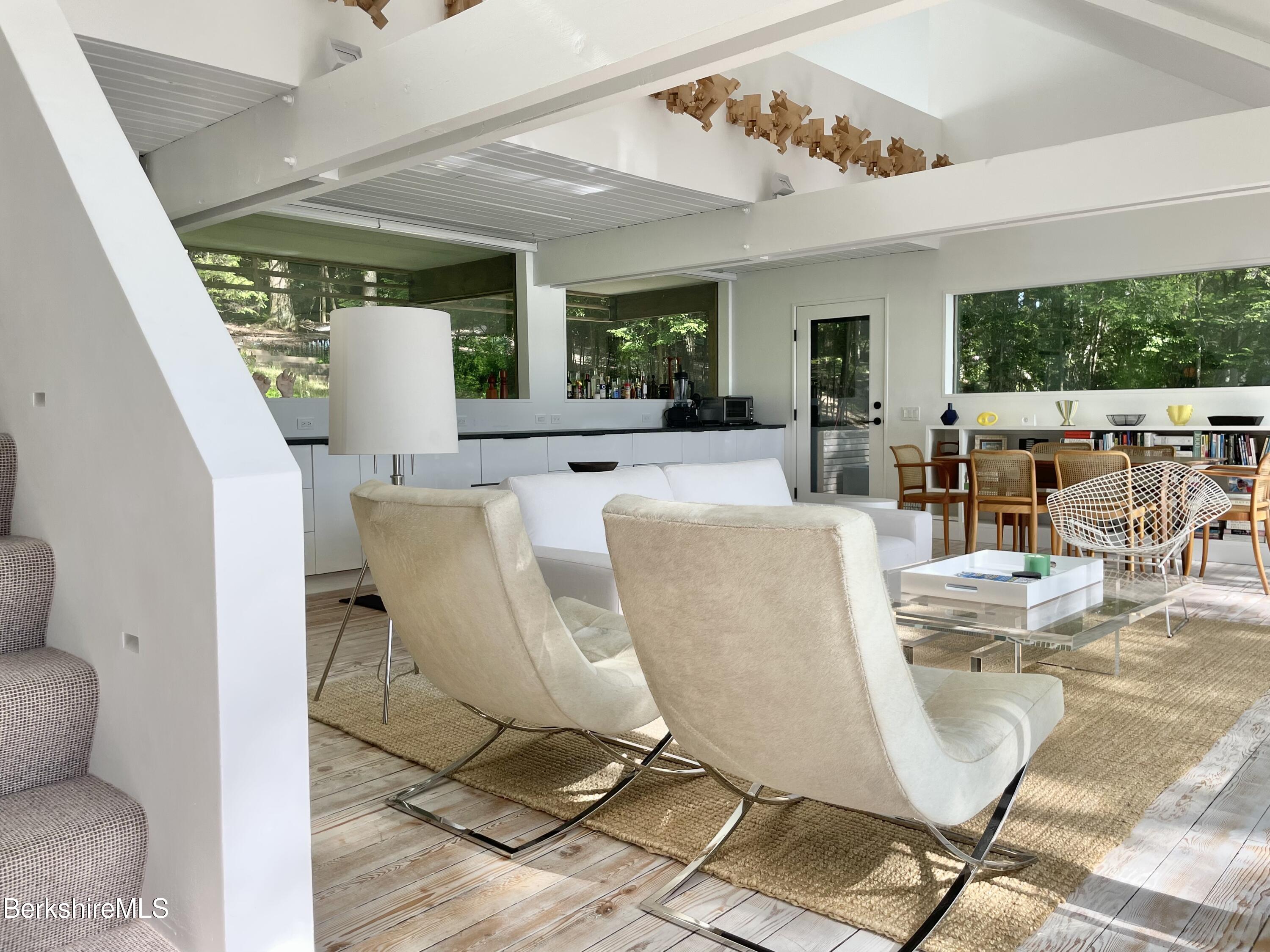 36 Elephant Rock Road Monterey, MA 01245 - Photo 15 of 30 a view of a dining room with furniture window and outside view