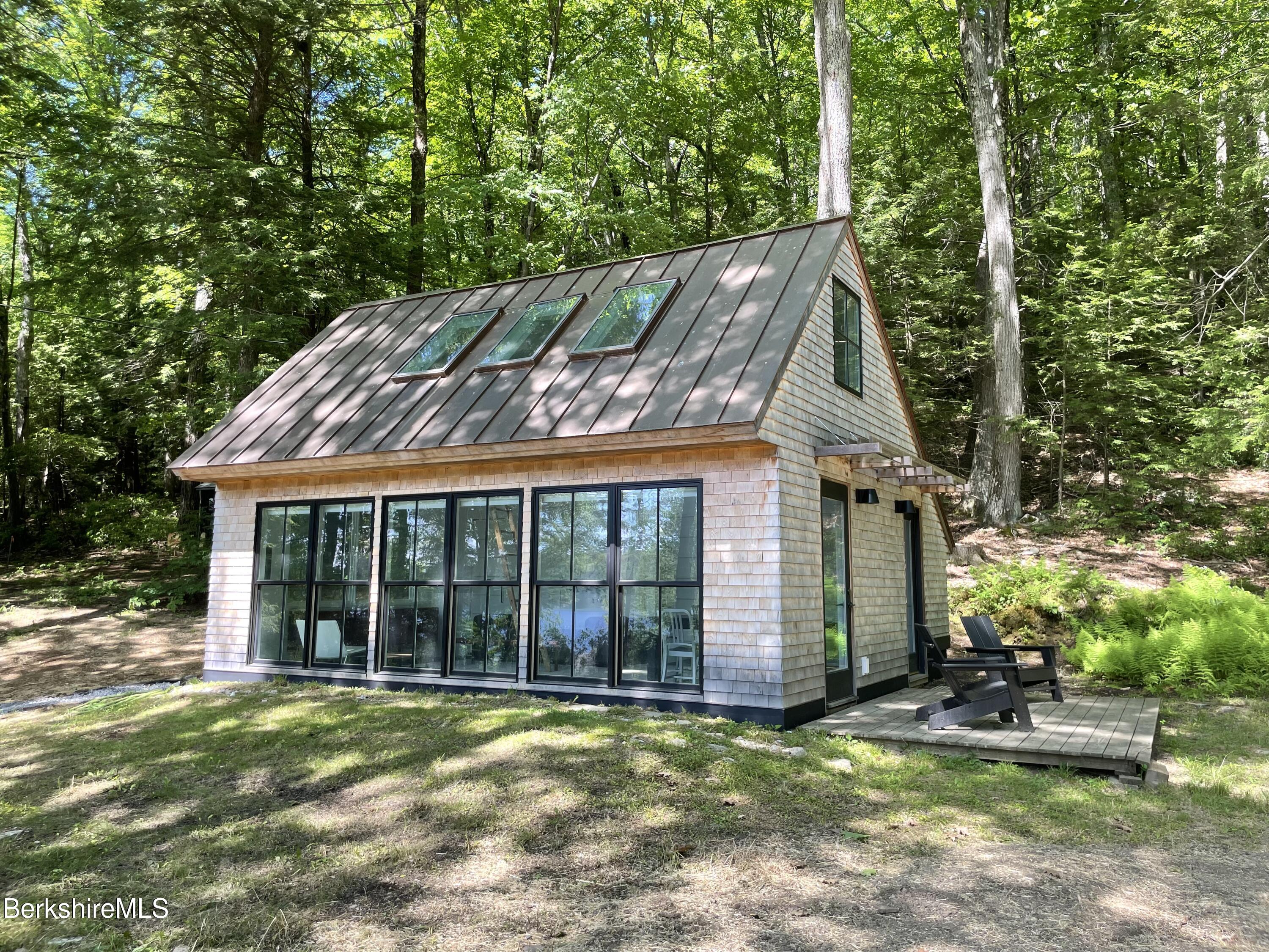 36 Elephant Rock Road Monterey, MA 01245 - Photo 22 of 30 a view of a house with backyard and porch