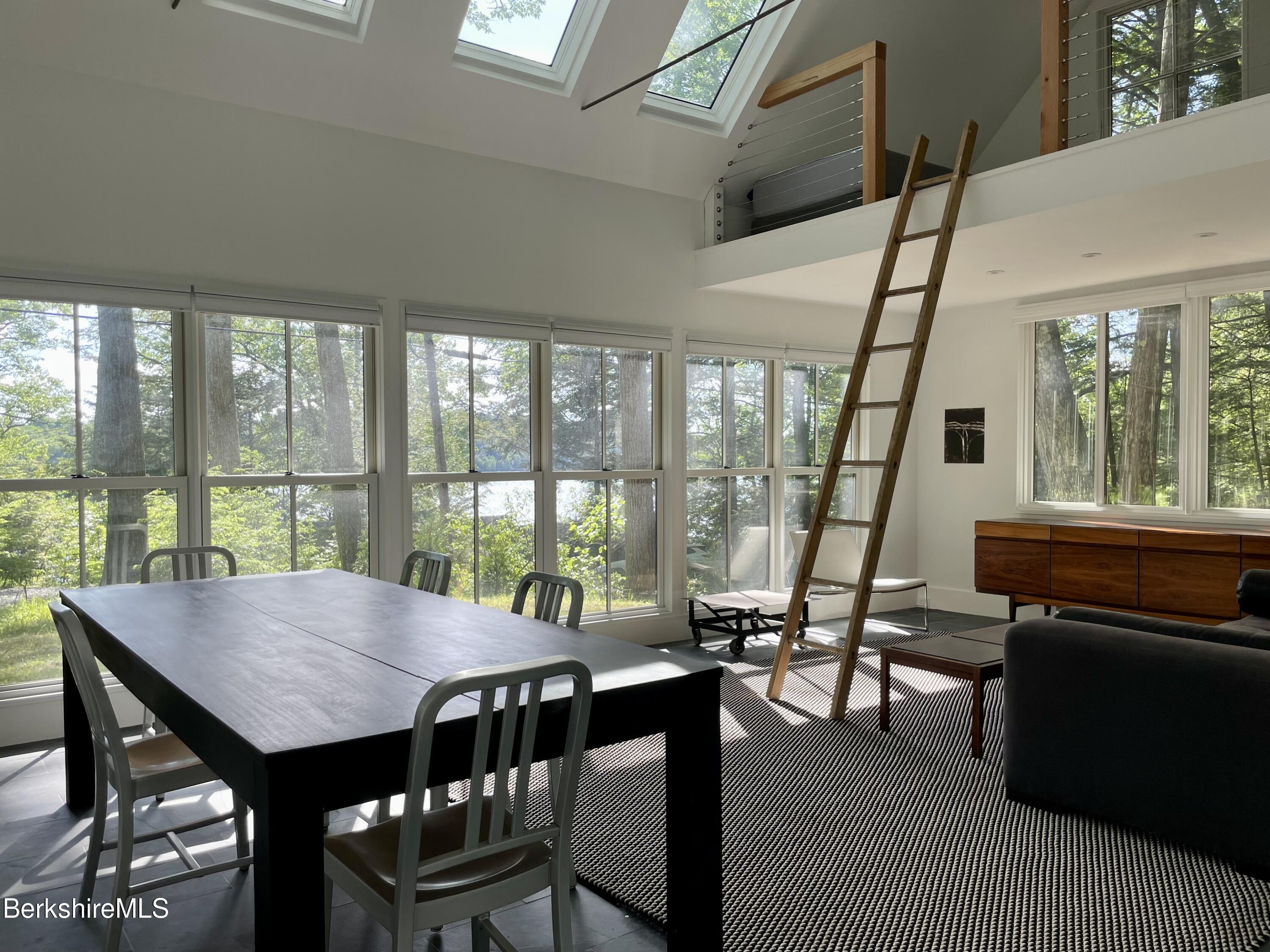 36 Elephant Rock Road Monterey, MA 01245 - Photo 23 of 30 a view of a dining room with furniture window and outside view