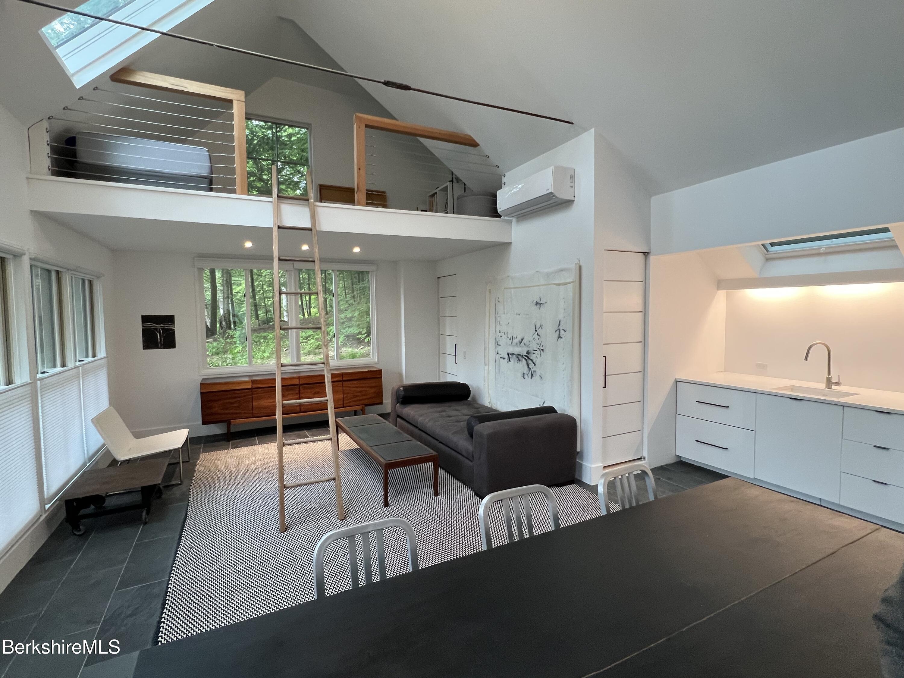 36 Elephant Rock Road Monterey, MA 01245 - Photo 24 of 30 a living room with furniture and a large window