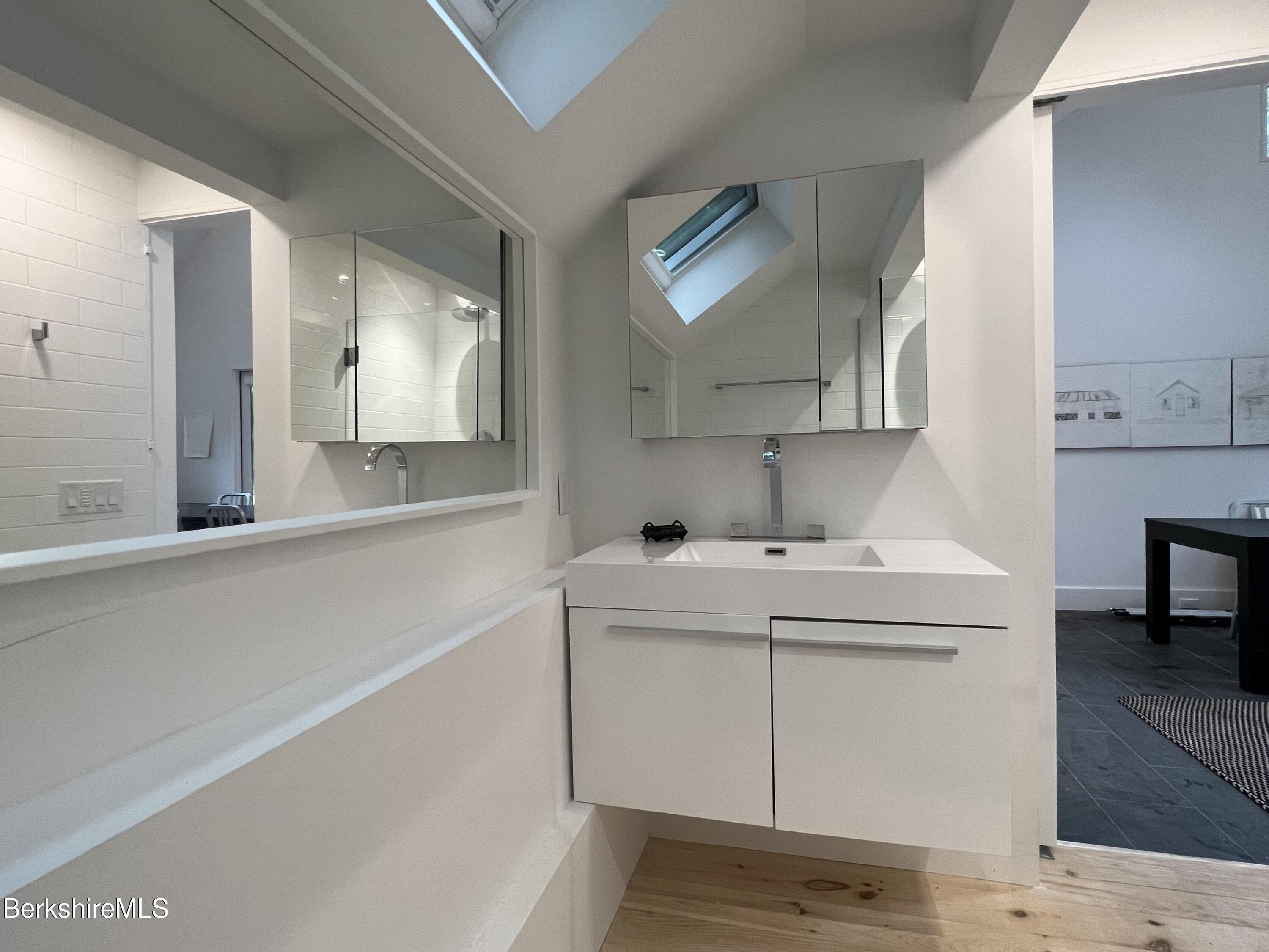 36 Elephant Rock Road Monterey, MA 01245 - Photo 25 of 30 a bathroom with a sink and a mirror