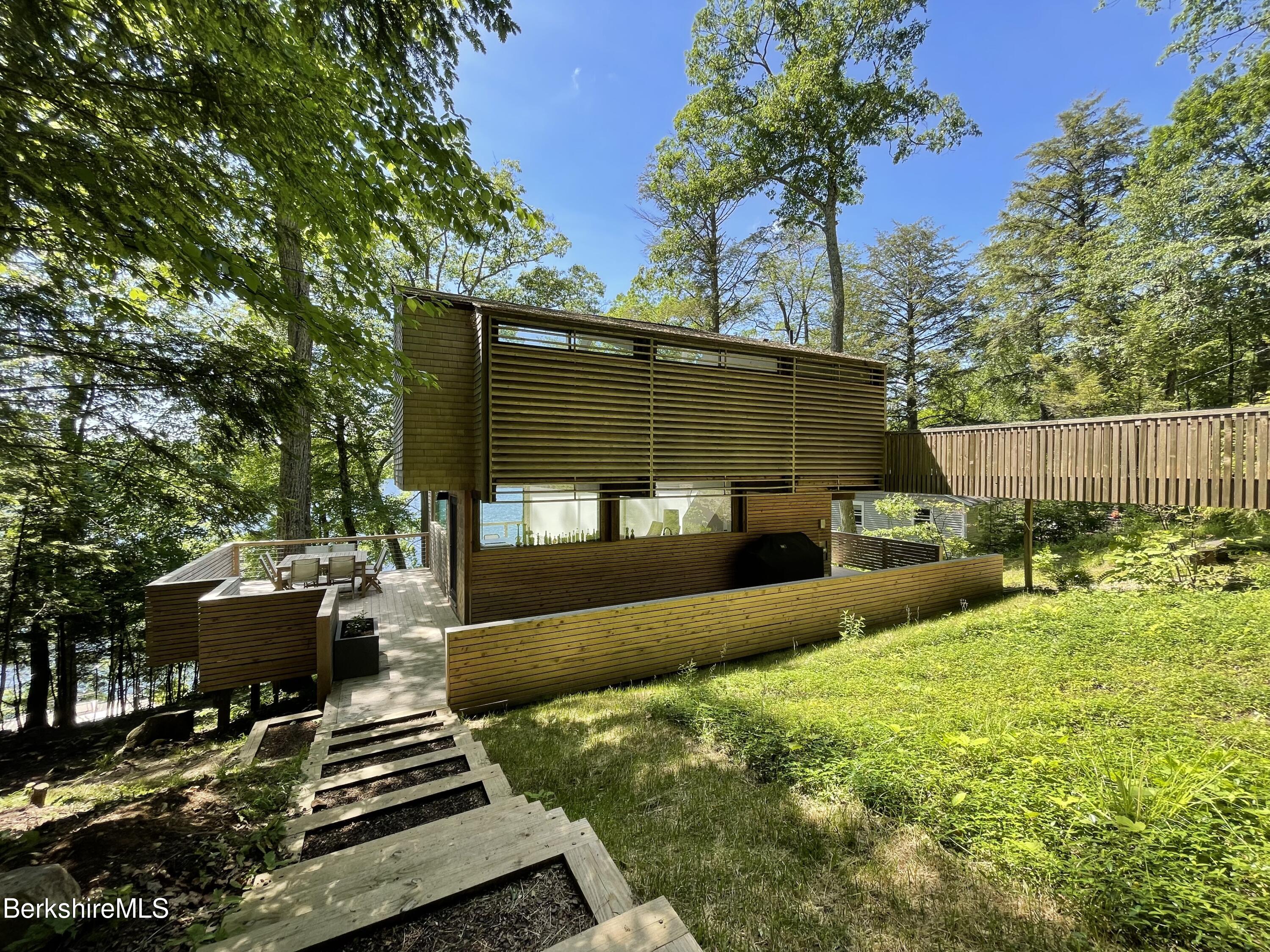 36 Elephant Rock Road Monterey, MA 01245 - Photo 5 of 30 a view of a backyard with plants and a garden