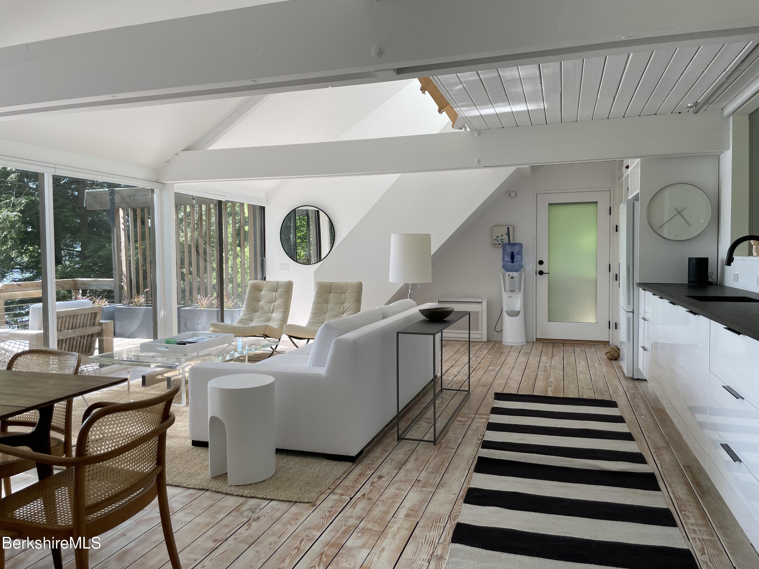 36 Elephant Rock Road Monterey, MA 01245 - Photo 8 of 30 a view of a dining room with furniture window and wooden floor