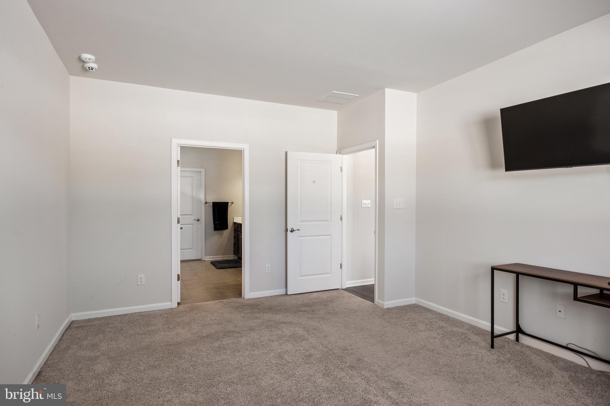 15 Walton Way Delanco, NJ 08075 - Photo 18 of 33 a view of a livingroom with an empty space and a flat screen tv