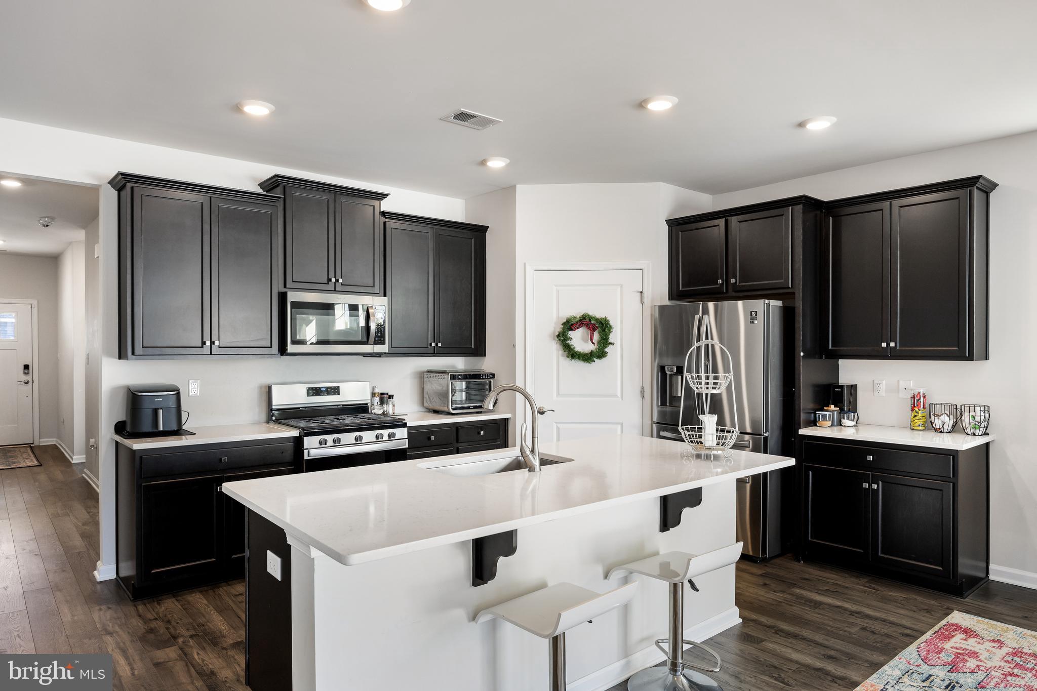 15 Walton Way Delanco, NJ 08075 - Photo 7 of 33 a kitchen with stainless steel appliances a sink stove and refrigerator