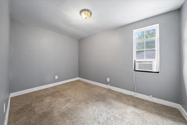 a kitchen with granite countertop a stove and a sink