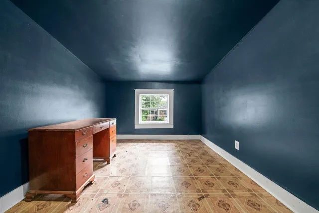 a view of outdoor space with wooden floor and city view