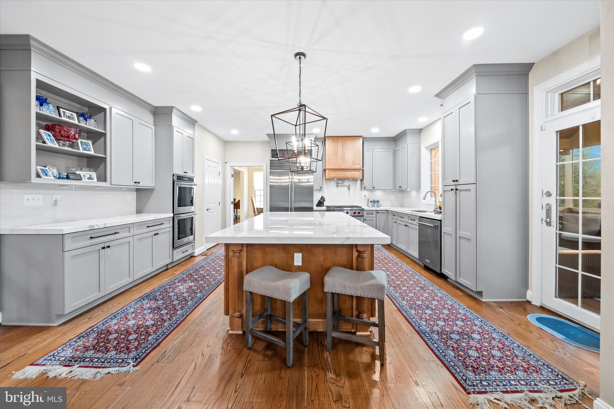3 Pheasants Ridge North Wilmington, DE 19807 - Photo 26 of 102 a dining hall with stainless steel appliances granite countertop a dining table and chairs with wooden floor