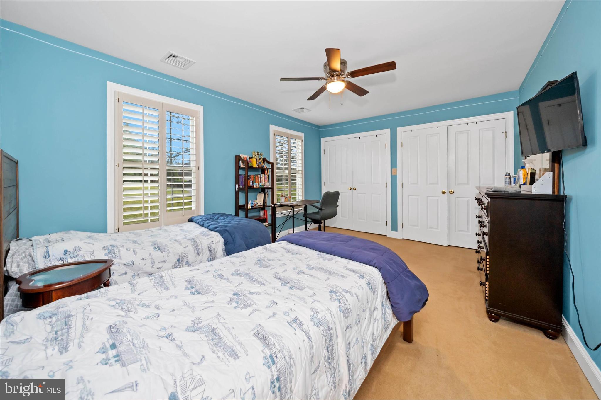 3 Pheasants Ridge North Wilmington, DE 19807 - Photo 57 of 102 a bedroom with a bed and a flat screen tv
