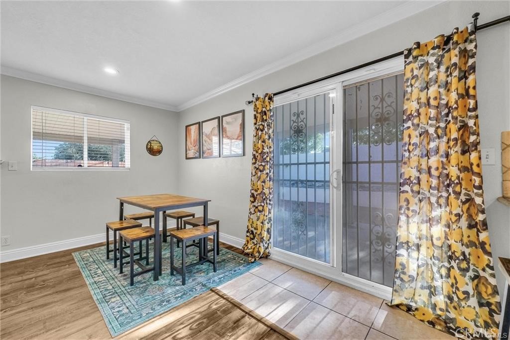 6220 Filkins Avenue Rancho Cucamonga, CA 91737 - Photo 5 of 16 a dining room with chandelier and wooden floor