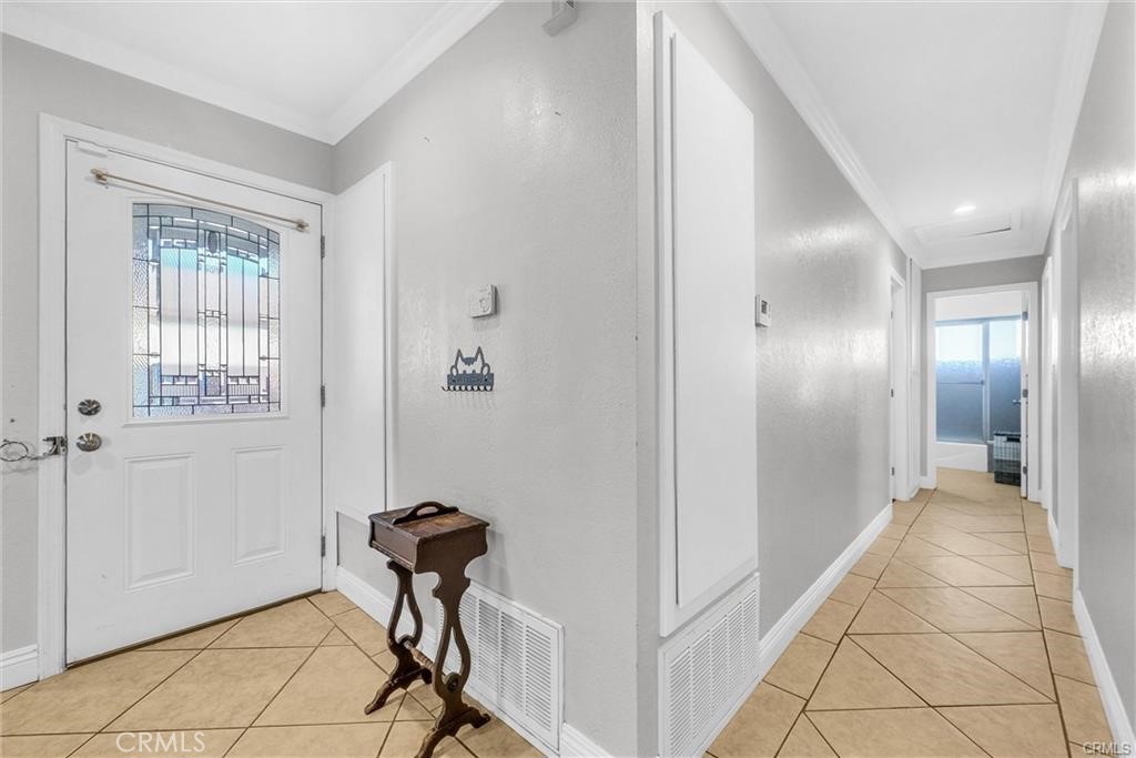 6220 Filkins Avenue Rancho Cucamonga, CA 91737 - Photo 9 of 16 a view of a hallway with a chandelier