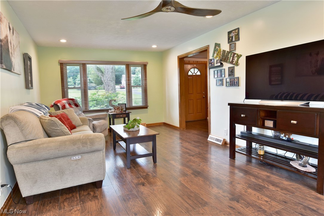 1711 Salt Springs Road Mineral Ridge, OH 44440 - Photo 21 of 35 Living room with ceiling fan and dark hardwood floors