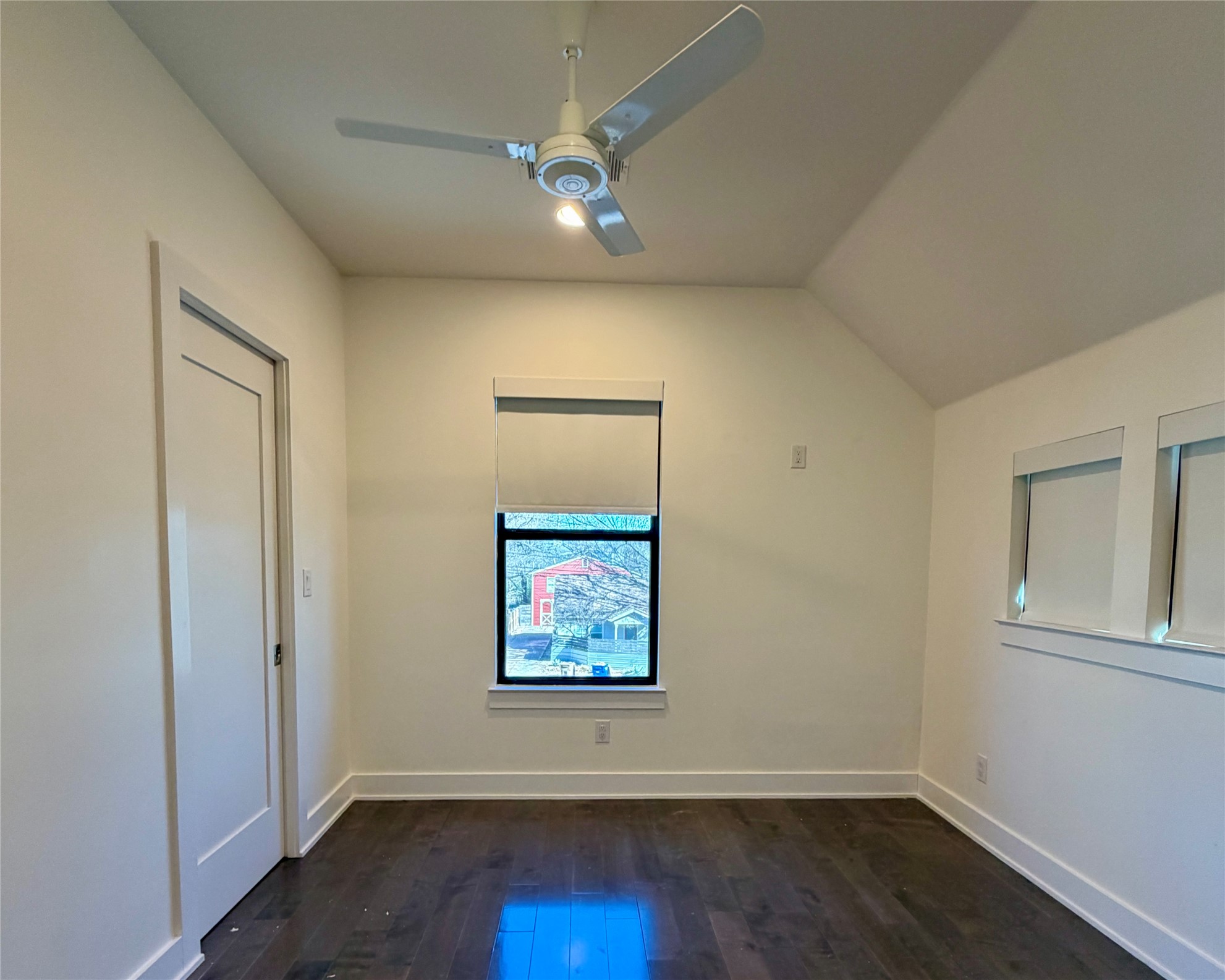 1515 Hether Street, Unit B Austin, TX 78704 - Photo 19 of 30 Hardwood floors and a vaulted ceiling elevate this comfortable room, ready for your personal touch.