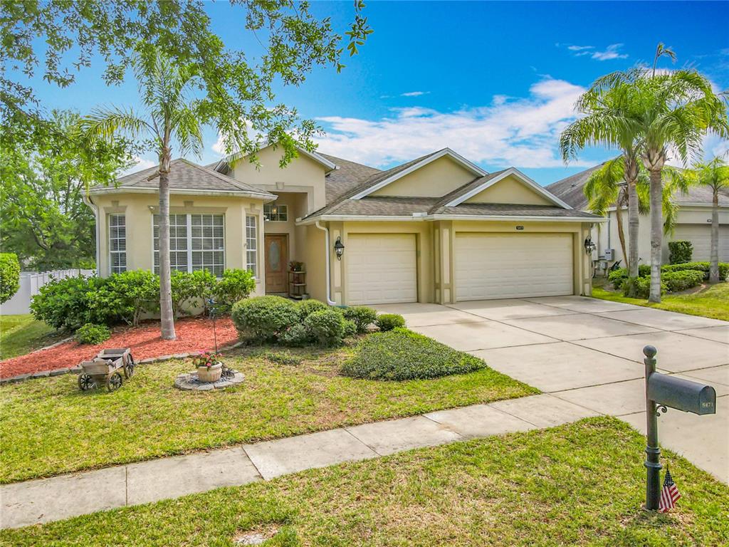 5471 Rishley Run Way Mount Dora, FL 32757 - Photo 1 of 1 a front view of a house with garden