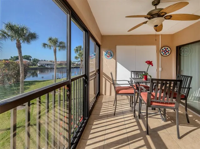 a view of a balcony with furniture and potted plants