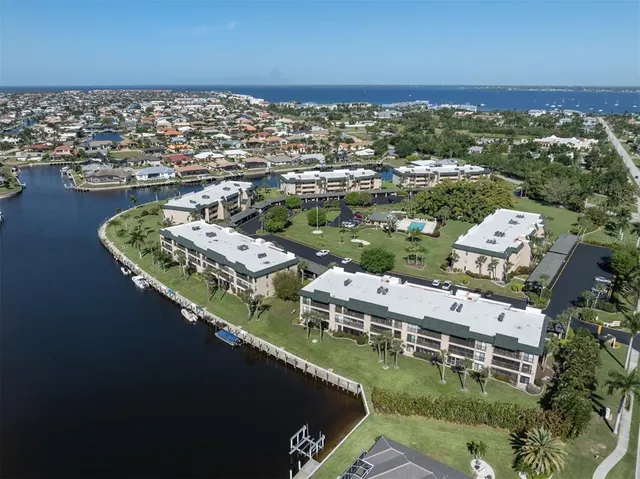 an aerial view of a house with a ocean view