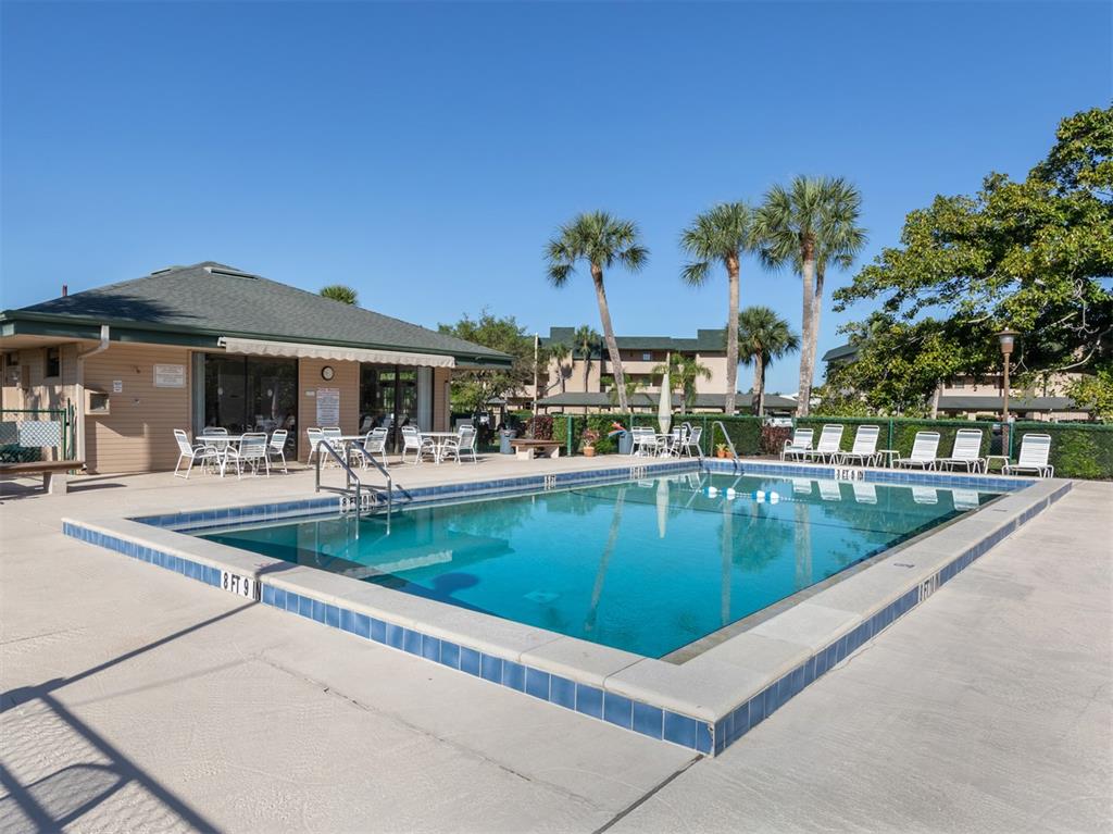 601 Shreve Street, Unit 51B Punta Gorda, FL 33950 - Photo 39 of 43 a view of a swimming pool with outdoor seating