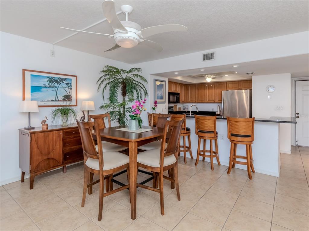 601 Shreve Street, Unit 51B Punta Gorda, FL 33950 - Photo 9 of 43 a dining area with furniture and chandelier