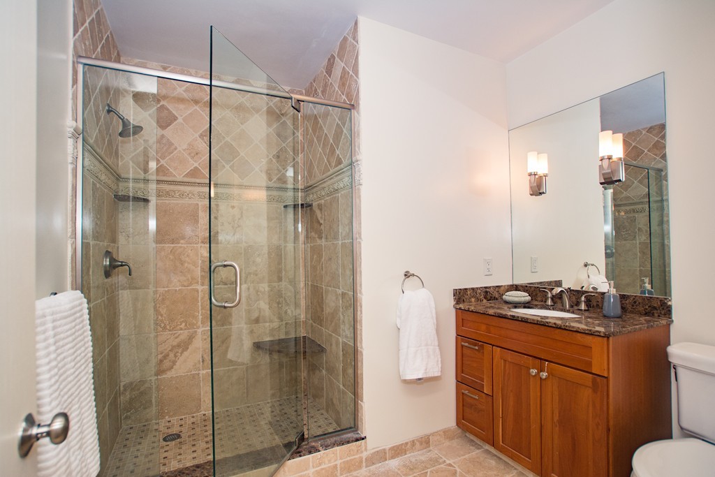 99-105 Broad Street, Unit 8C Boston, MA 02110 - Photo 23 of 28 a bathroom with a sink and shower