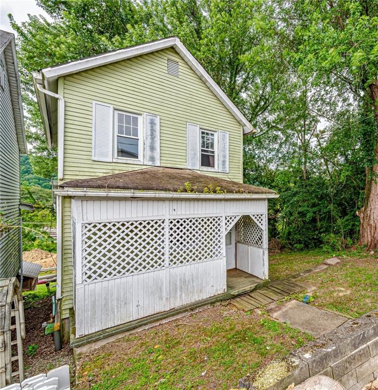 4 Howe Street Elrama, PA 15038 - Photo 1 of 29 a view of a house with a backyard