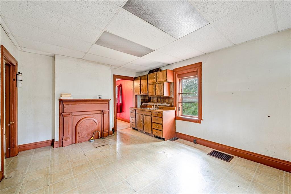 4 Howe Street Elrama, PA 15038 - Photo 4 of 29 a view of a kitchen with a sink and a stove top oven