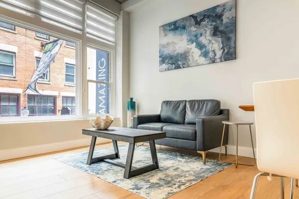 a living room with furniture and a window