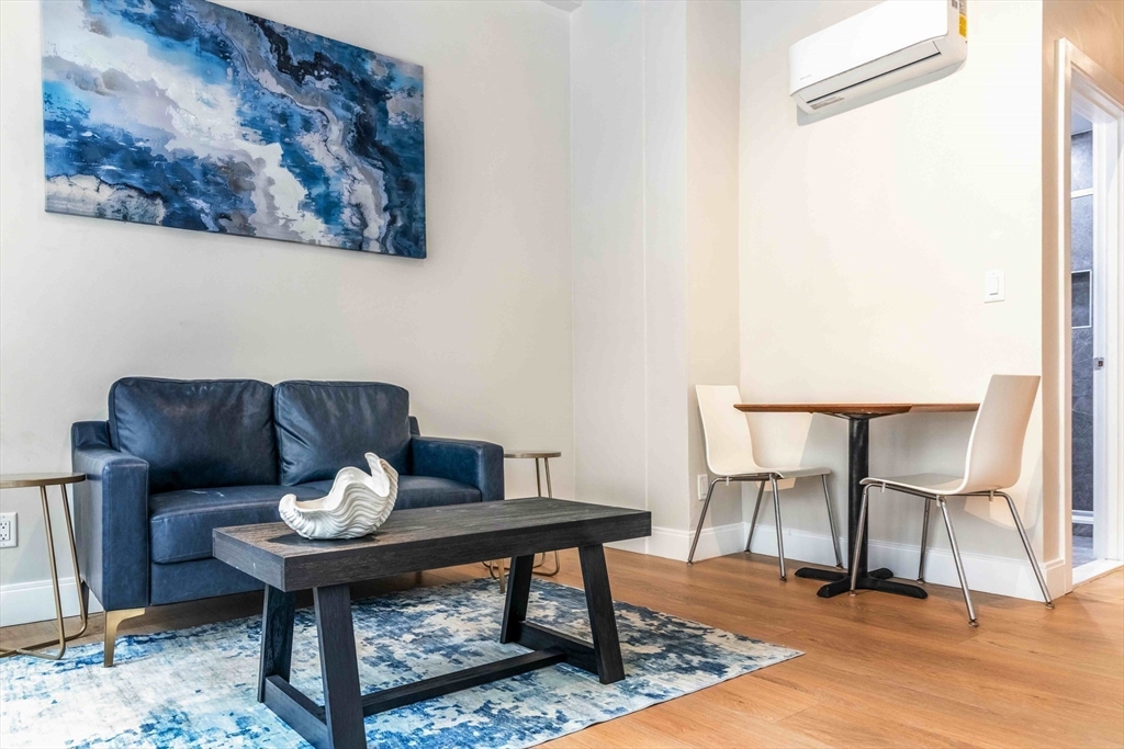 44 Bromfield Street, Unit 204 Boston, MA 02108 - Photo 2 of 7 a view of a workspace with furniture