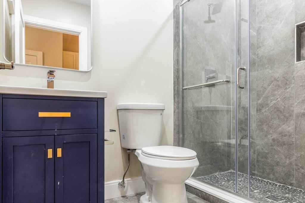 44 Bromfield Street, Unit 204 Boston, MA 02108 - Photo 4 of 7 a bathroom with a sink a toilet and shower