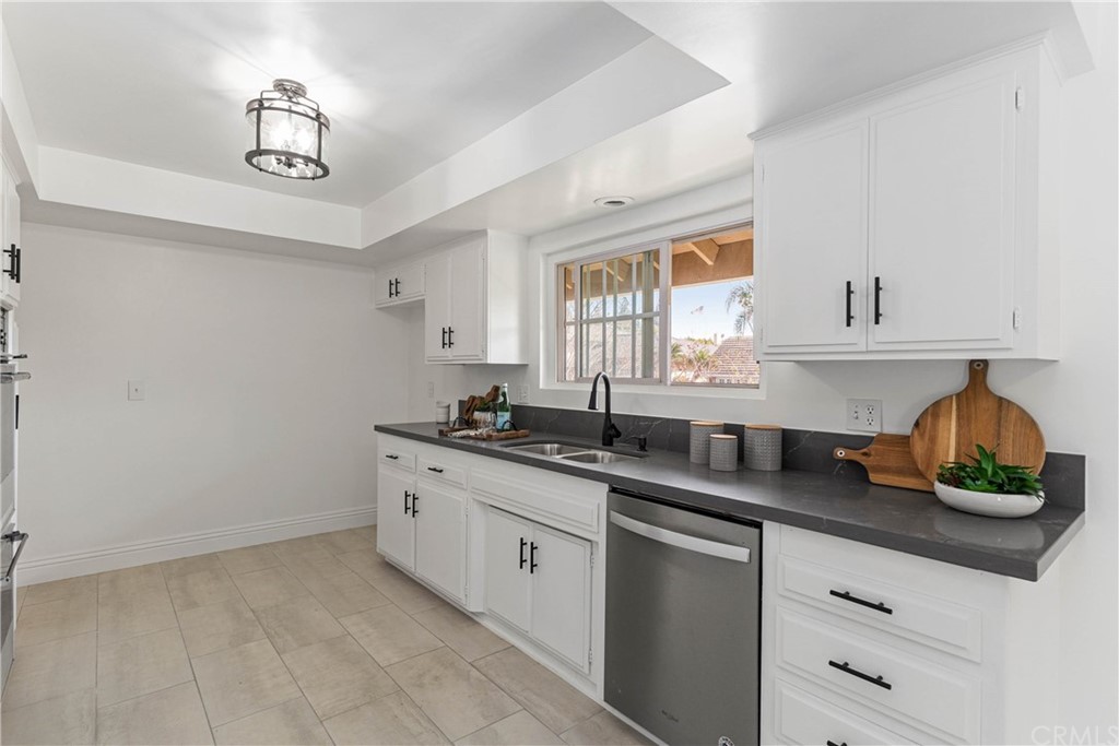 1766 North Mockingbird Place Orange, CA 92867 - Photo 14 of 39 a kitchen with a sink and cabinets