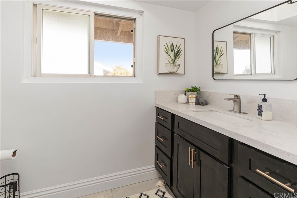 1766 North Mockingbird Place Orange, CA 92867 - Photo 18 of 39 a bathroom with a sink a vanity and a window