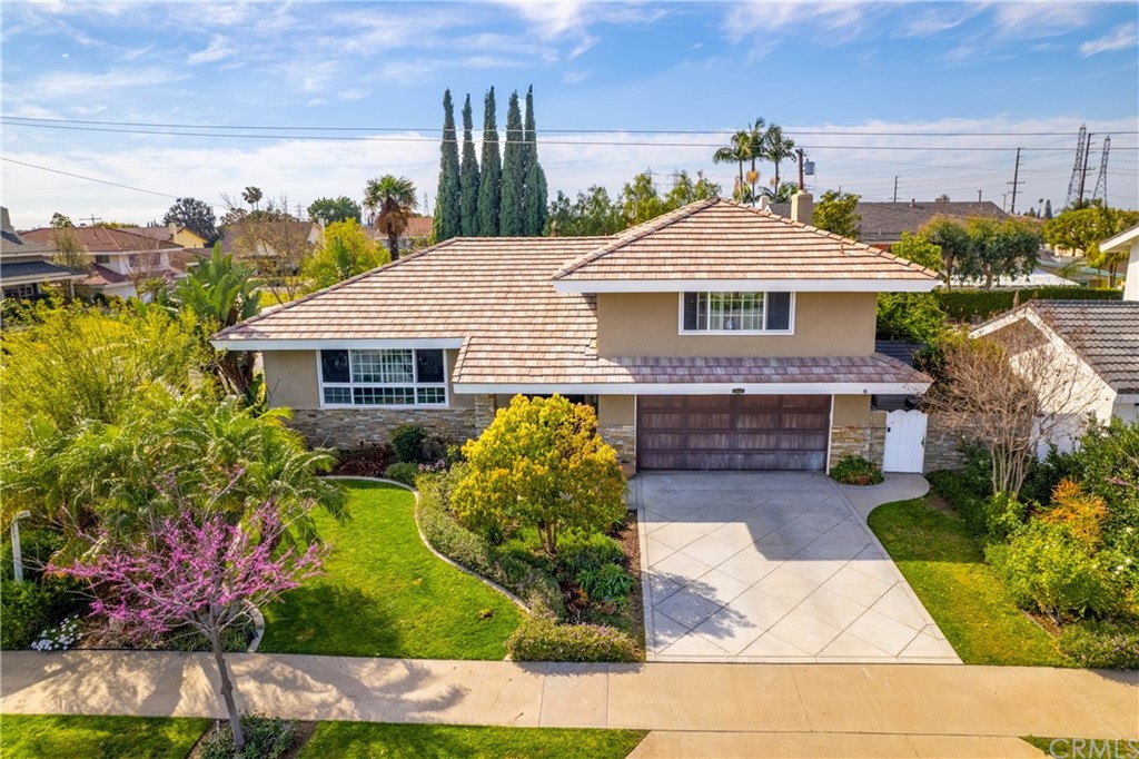 1766 North Mockingbird Place Orange, CA 92867 - Photo 2 of 39 a front view of a house with garden