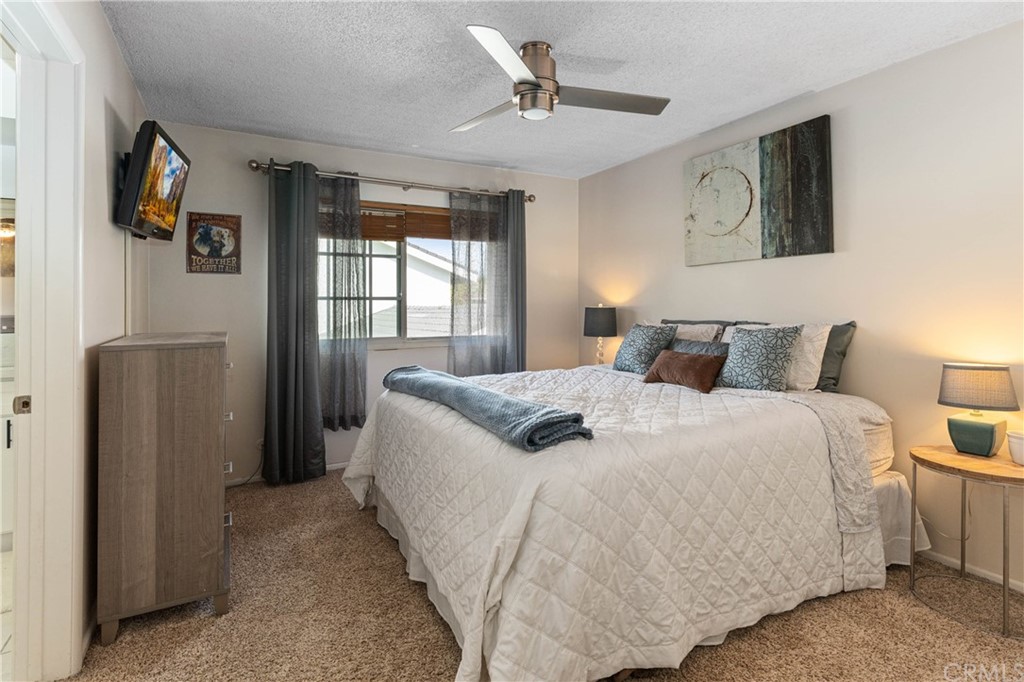 1766 North Mockingbird Place Orange, CA 92867 - Photo 21 of 39 a bedroom with a large bed and a chandelier