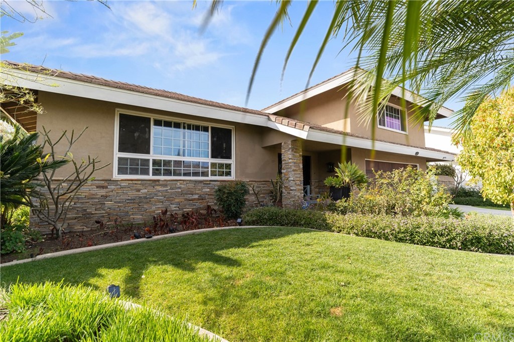 1766 North Mockingbird Place Orange, CA 92867 - Photo 3 of 39 a front view of a house with garden