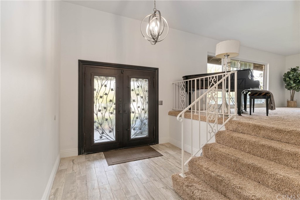 1766 North Mockingbird Place Orange, CA 92867 - Photo 9 of 39 a view of entryway and hall with wooden floor