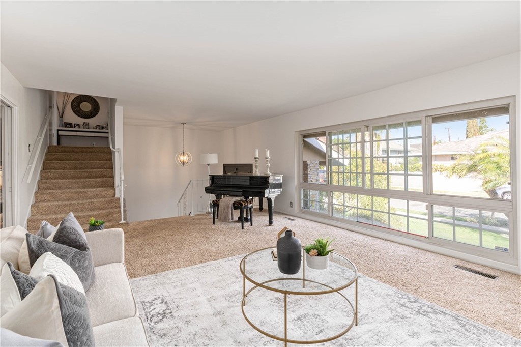 1766 North Mockingbird Place Orange, CA 92867 - Photo 10 of 39 a living room with furniture and a potted plant
