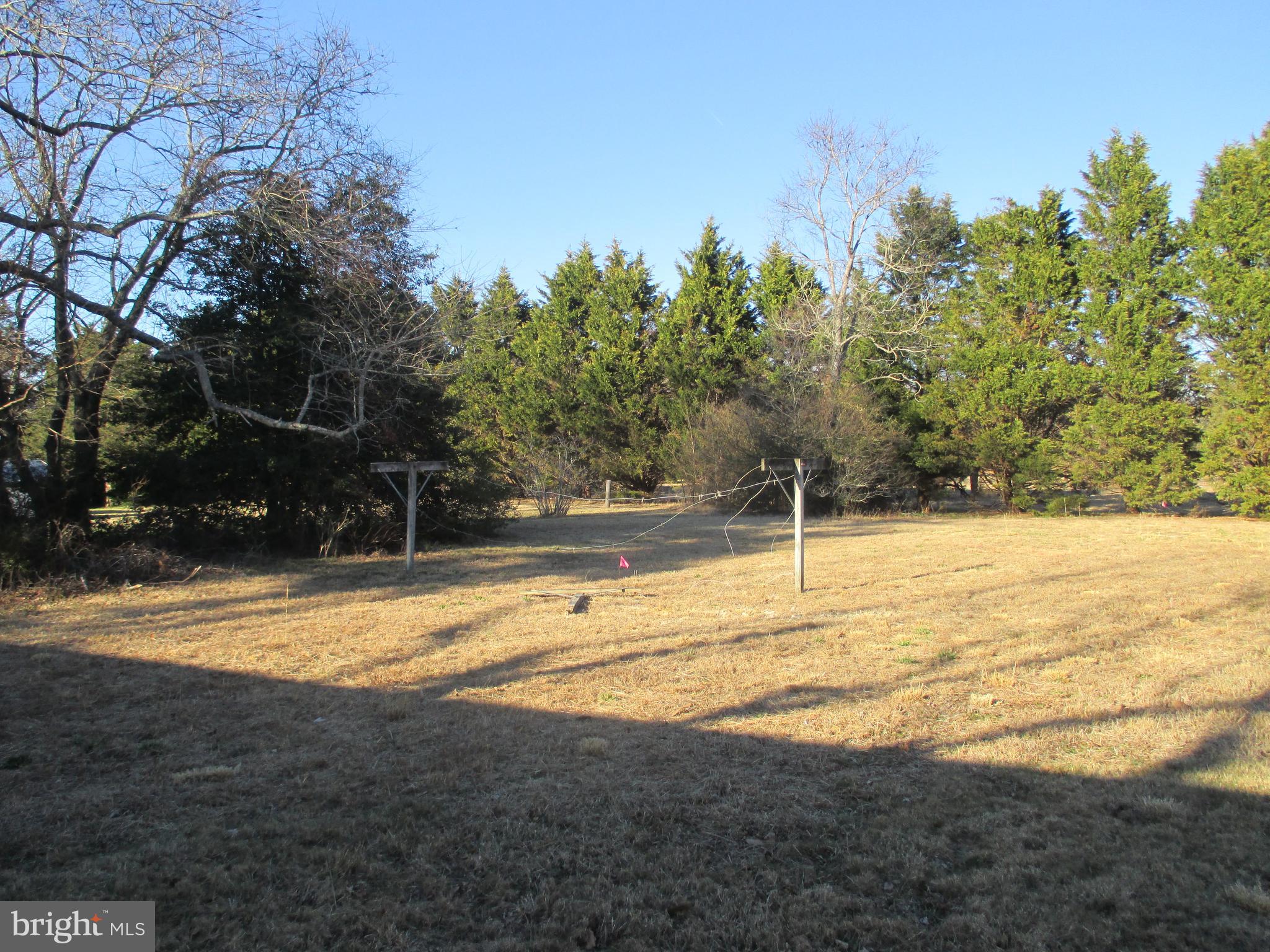 29791 Armory Road Dagsboro, DE 19939 - Photo 1 of 12 a view of a swimming pool with an outdoor space and seating area