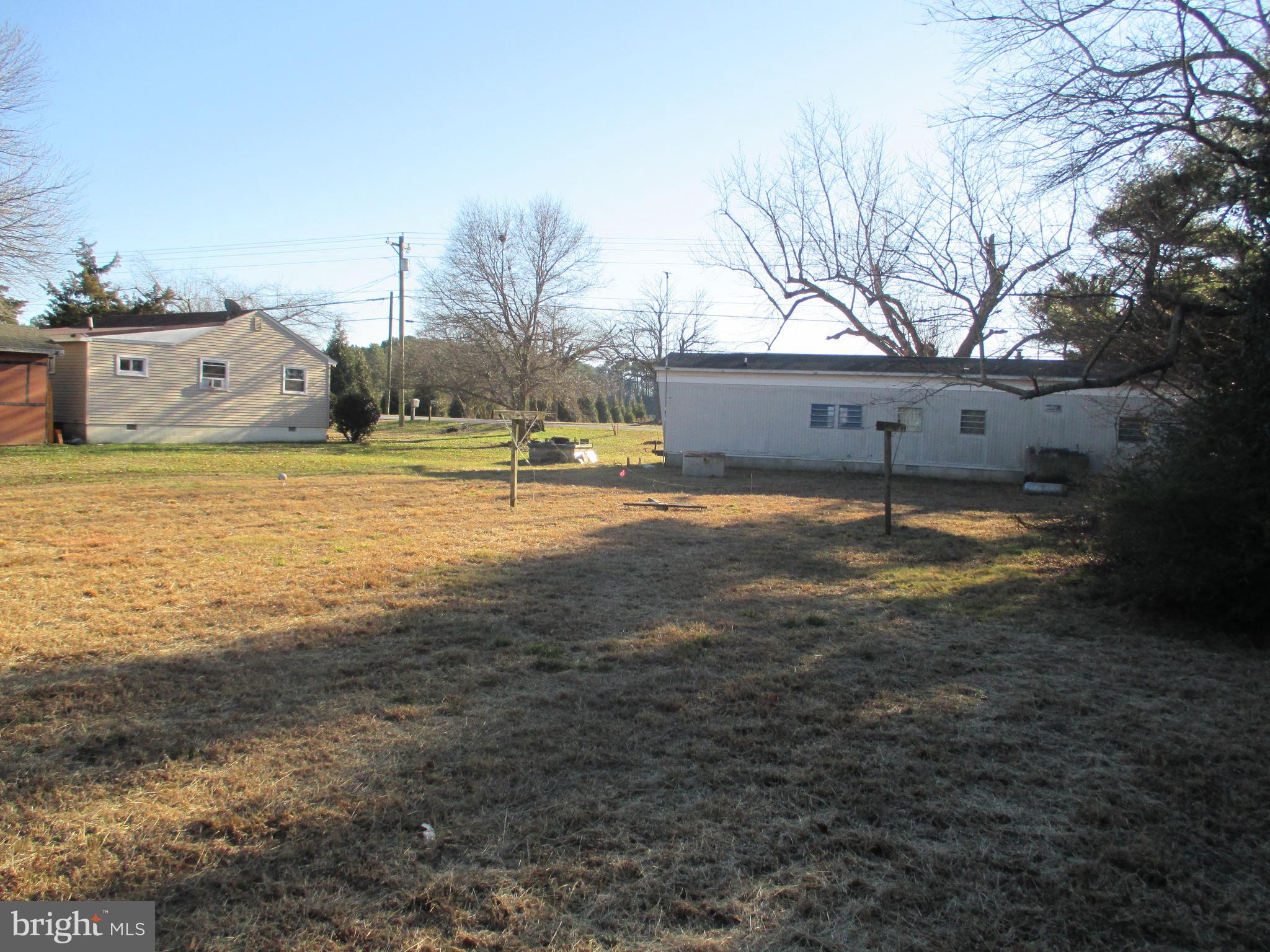 29791 Armory Road Dagsboro, DE 19939 - Photo 10 of 12 a swimming pool with an outdoor space and seating area