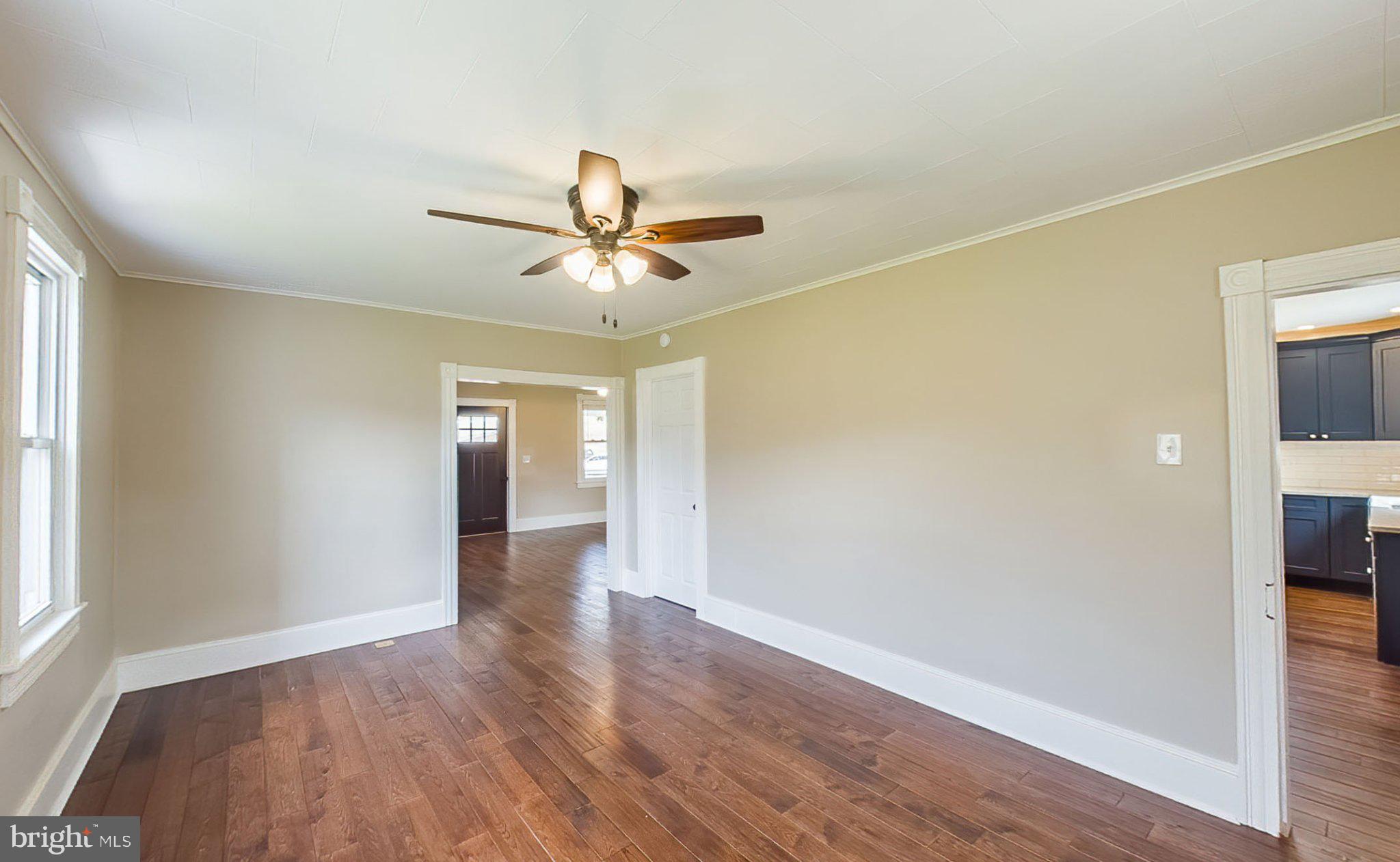 648 Main-Mifflin Road Nescopeck, PA 18635 - Photo 25 of 64 an empty room with wooden floor and windows