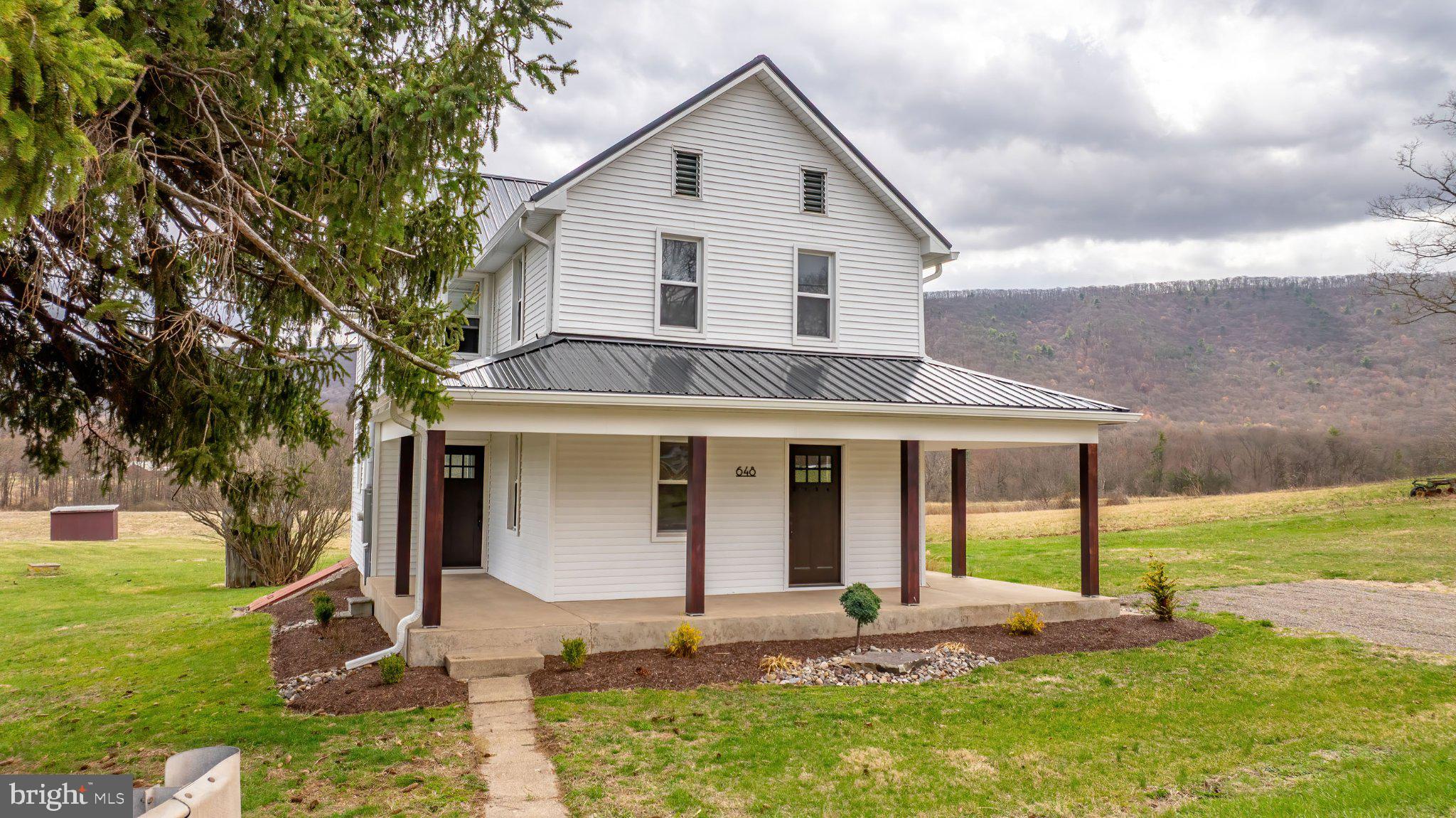 648 Main-Mifflin Road Nescopeck, PA 18635 - Photo 32 of 64 a view of a house with backyard and sitting area