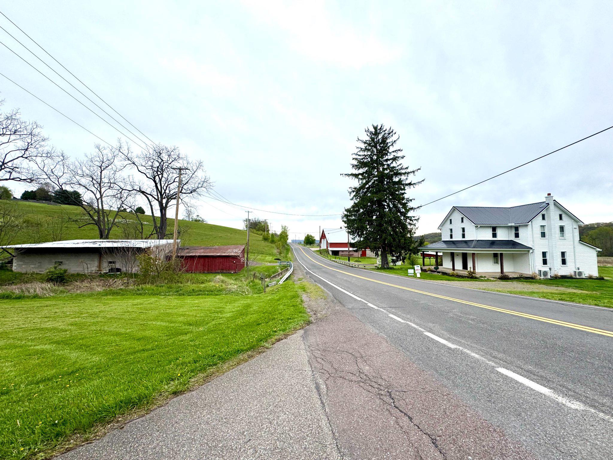 648 Main-Mifflin Road Nescopeck, PA 18635 - Photo 41 of 64 a view of street with houses and trees in the background