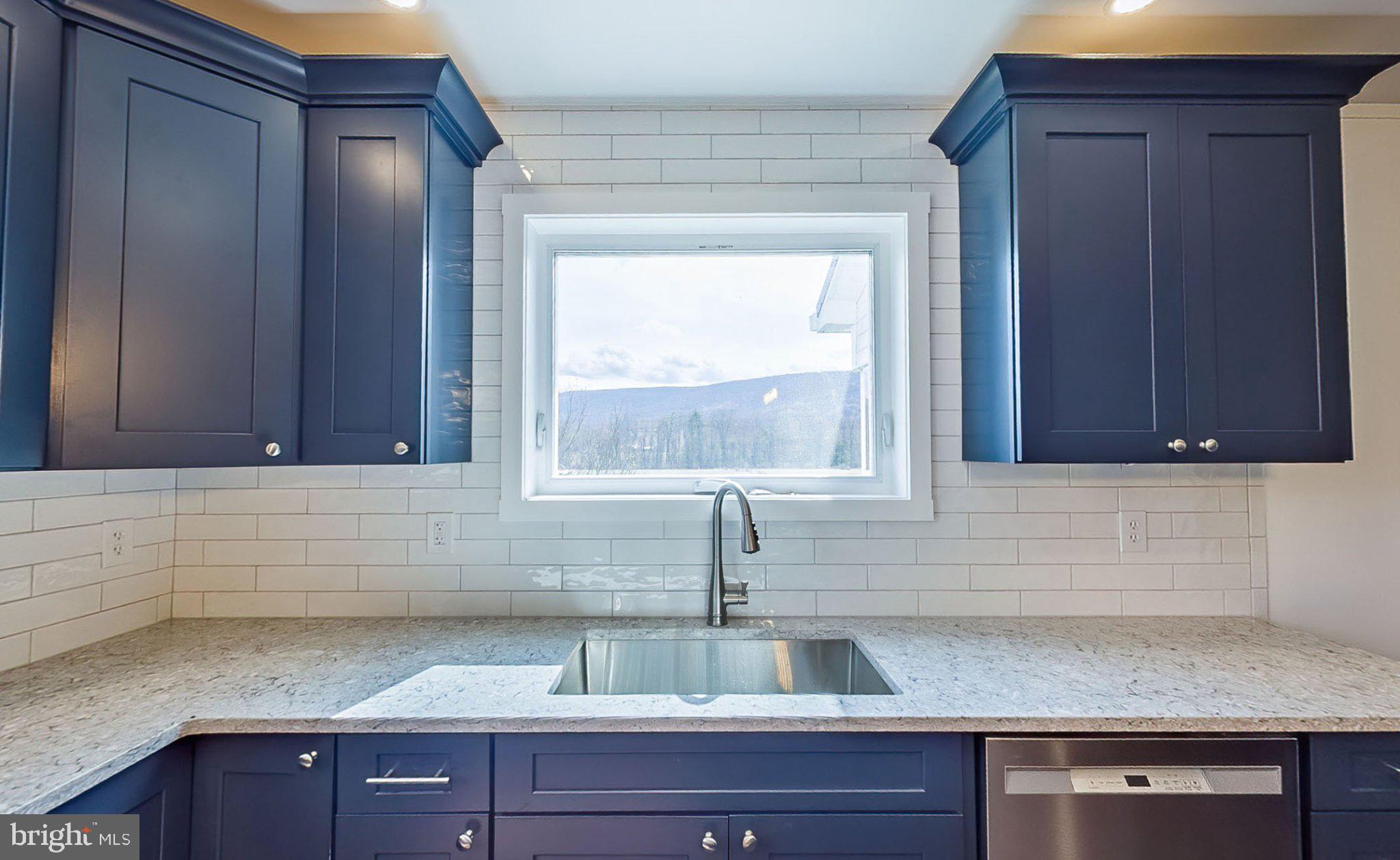 648 Main-Mifflin Road Nescopeck, PA 18635 - Photo 7 of 64 a kitchen with a sink and cabinets