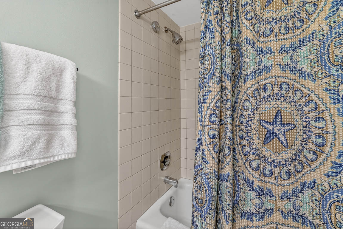 201 Neptune Road, Unit 258 St. Simons, GA 31522 - Photo 18 of 52 a bathroom with a bathtub and shower