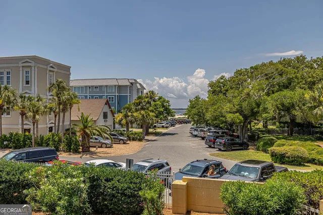 a view of a house with a yard and sitting area
