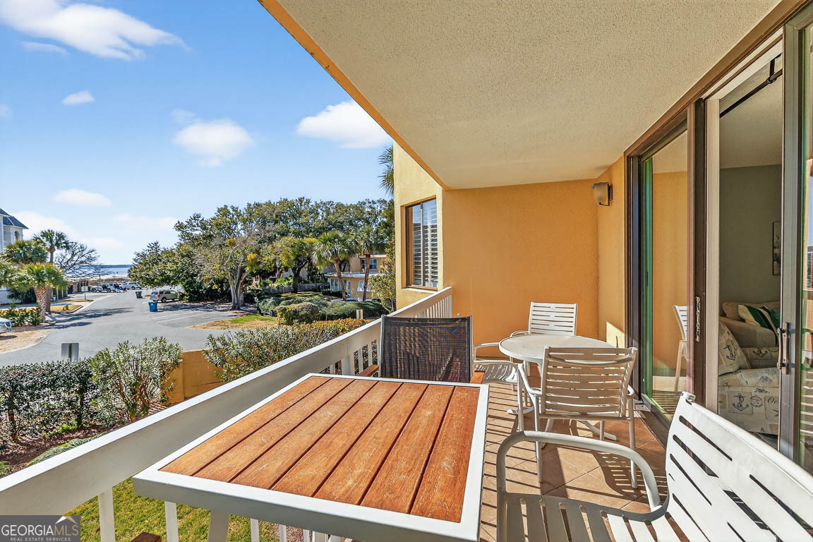 201 Neptune Road, Unit 258 St. Simons, GA 31522 - Photo 25 of 52 a view of balcony with wooden floor and outdoor space