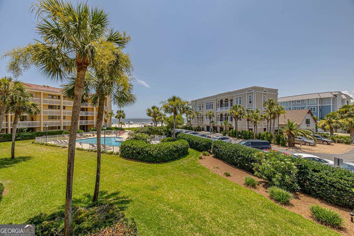 201 Neptune Road, Unit 258 St. Simons, GA 31522 - Photo 26 of 52 a view of a garden with a building in the background