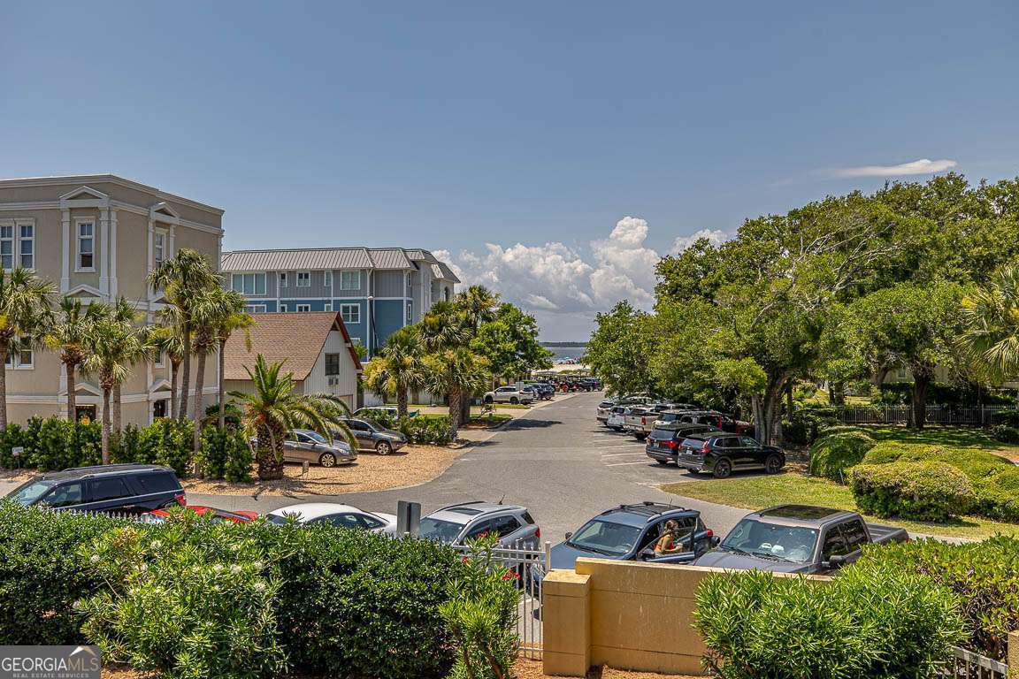 201 Neptune Road, Unit 258 St. Simons, GA 31522 - Photo 27 of 52 a view of a house with a yard and sitting area