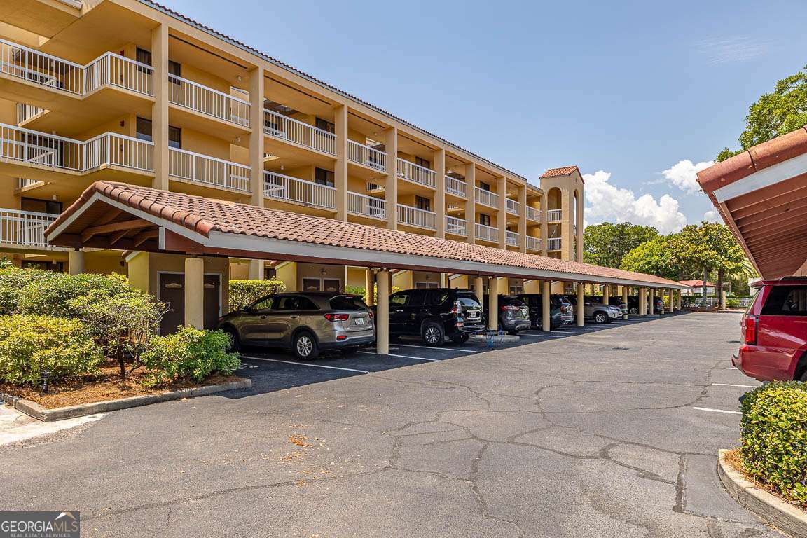 201 Neptune Road, Unit 258 St. Simons, GA 31522 - Photo 29 of 52 front view of a building with a porch