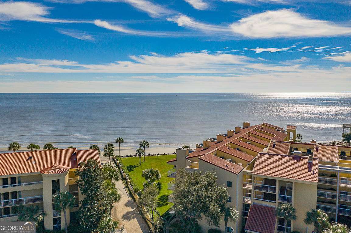 201 Neptune Road, Unit 258 St. Simons, GA 31522 - Photo 30 of 52 an aerial view of multiple houses with a yard